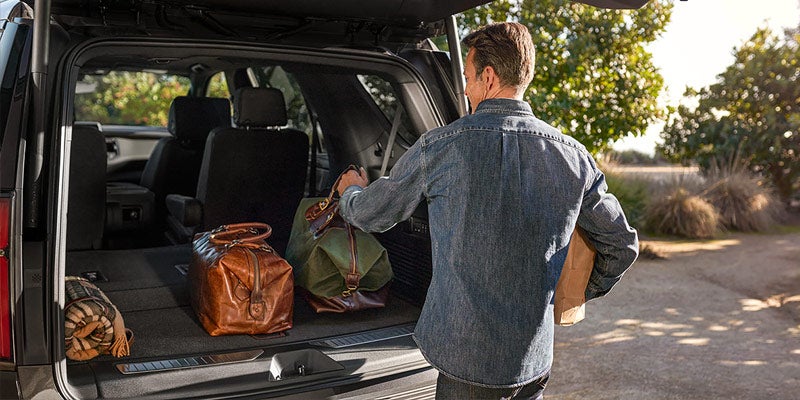 2021 Chevrolet Tahoe Man loading cargo
